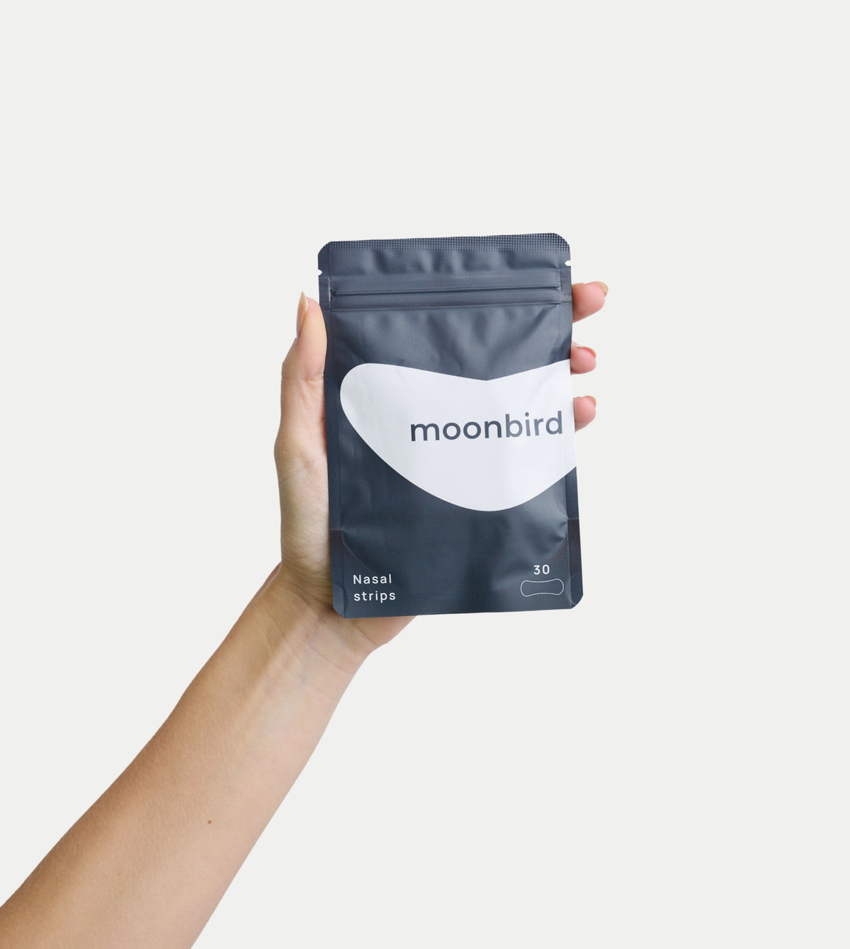 moonbird nasal strips pouch held in a hand